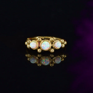 gold coloured Indian nose ring with tribal dots and opal stones