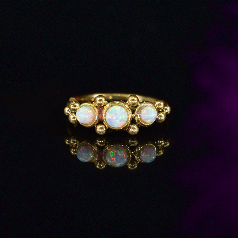 gold coloured Indian nose ring with tribal dots and opal stones