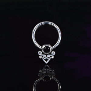 hinged piercing ring with tribal heart filigree and onyx stone