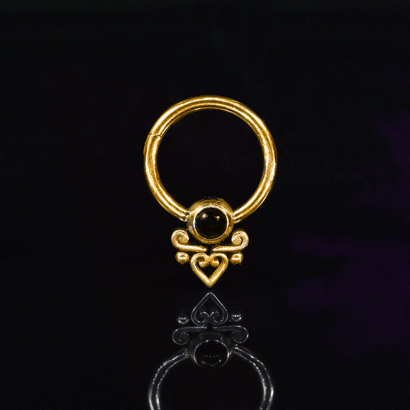 hinged segment piercing ring in gold steel with tribal heart and black onyx stone