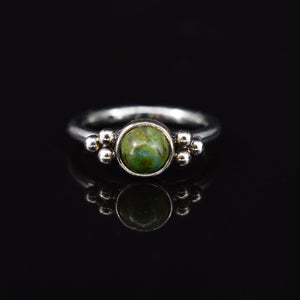 hinged segment ring with african jade stone and tribal dots